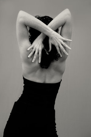 Portrait of younf seductive fashion woman standing isolated - back viewの写真素材