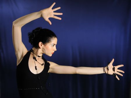 Portrait of young hispanic female with open handsの写真素材