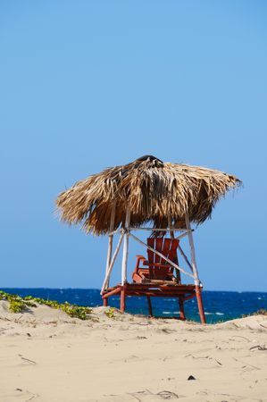 A view of rustic chair on tropical beach sceneの写真素材