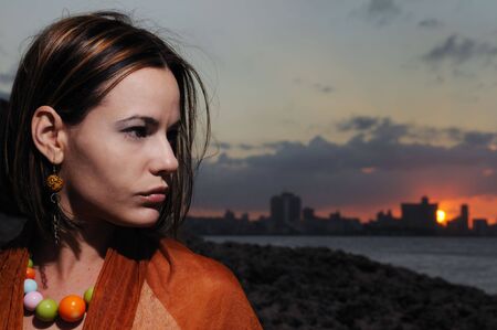 Portrait of young beauty against sunset background - havana skyline の写真素材