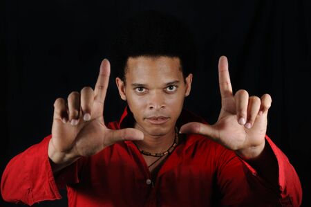 Portrait of young handsome african man framing faceの写真素材