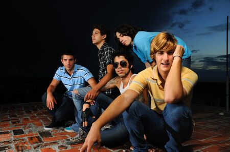 Portrait of young trendy group of male friends standing with attitudeの写真素材