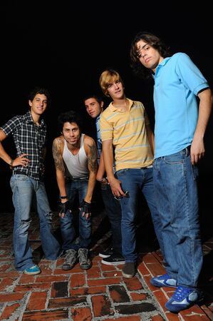 Portrait of young trendy group of friends standing with attitudeの写真素材