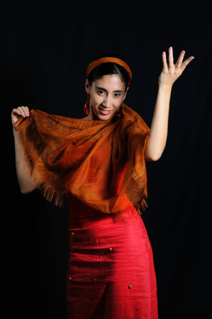 Portrait of hispanic flamenco dancer woman isolated on black
