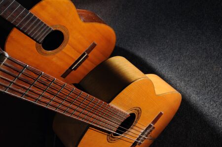 Detail of two old wooden acoustic guitars - still lifeの写真素材