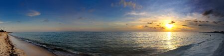 A panoramic view of tropical cuban beach at sunset, Playa Ancon, cuba.の写真素材