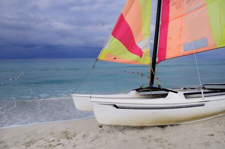 Sailing boat parked on the sand of tropical cuban beachの写真素材