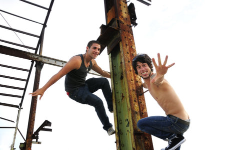 Portrait of two young trendy male friends - isolatedの写真素材