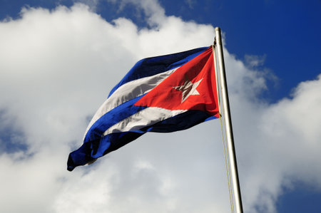 Cuban flag waving under blue sky background