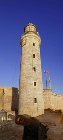 View of El morro spanish fortress lighthouse and cannon at Havana bayの写真素材
