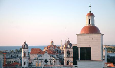 Old havana skyline with morro fortress in the background at sunsetの写真素材