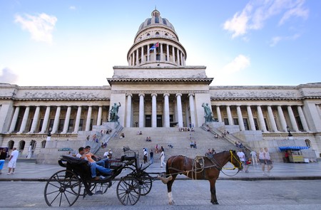 View of Capitoly building in Havana city with horse carriage in the front, November 2009.のeditorial素材