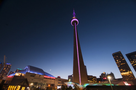 TORONTO, CANADA - MAY 31, 2014  View of the CN Tower and Rogers Center, opened in 1989 as the home of Toronto Blue Jays and is the first to have retractable motorized roof   のeditorial素材