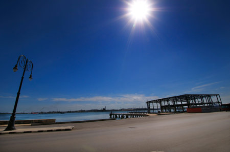 View of Old havana street with abandoned pier against blue skyの写真素材