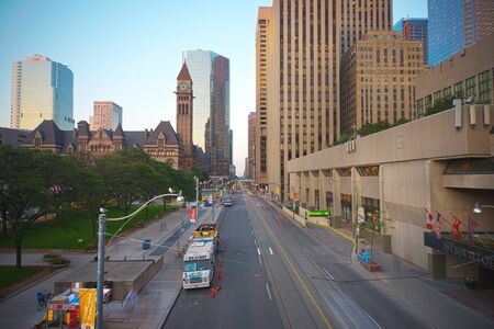 TORONTO,CANADA-JULY 9,2015: A view of Queen street in downtown toronto with Old City Hall building in the background, home to the city council from 1899 to 1966 and one of the city's most prominent structures.のeditorial素材