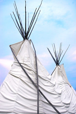 Detail of Teepee or wigwam topsagainst blue sky