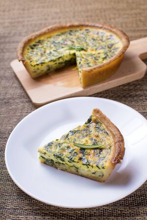 Delicious spinach quiche and smaller portion servedの写真素材