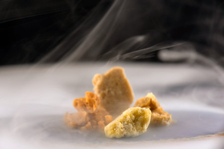 Four different kinds of marijuana extraction concentrate aka wax crumble on smoky background