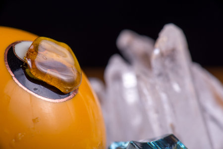 Macro detail of cannabis extraction aka as shatter over yellow surface- medical marijuana backgroundの写真素材