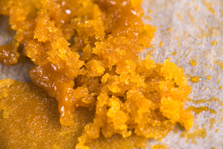 Abstract background of cannabis concentrate live resin macro detail extracted from medical marijuanaの写真素材