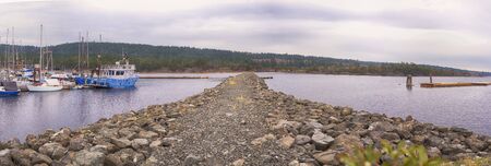 Panoramic view of fishing boats in Ladysmith marina and Oyster Bay, taken in Vancouver Island, British Columbia, Canadaの写真素材