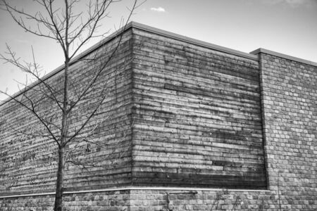Abstract architecture background with wood and brick walls building exterior against sky の写真素材