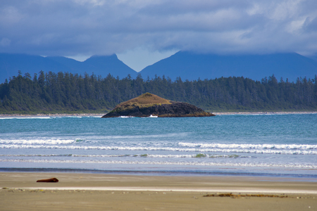 View of ocean waves and shoreline at long beach in Tofino, Vancouver Island, Canadaの写真素材