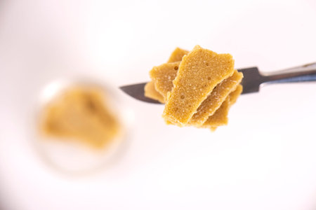 Detail of cannabis concentrate extracted from the marijuana plant for medical use, isolated over...