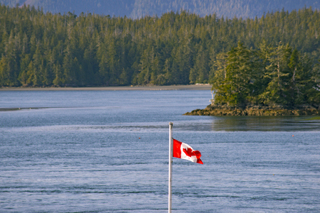 View of the shoreline of Meares Island and hill tops in Tofino, Vancouver Island, Canadaの写真素材