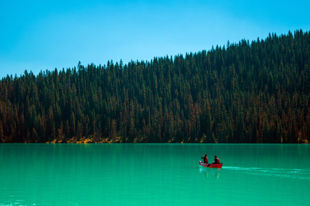 Scenic view of the Lake Louise at Banff National Park with a red canoe