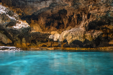 Cave pool with turquoise waterの写真素材