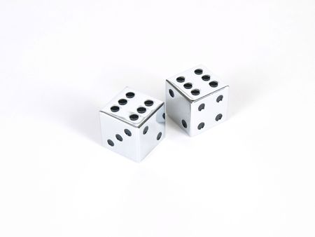 A pair of silver dice showing double sixes, or boxcars, on a white background.の写真素材