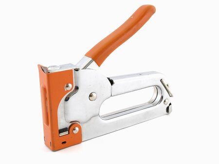 A heavy duty stapler for industrial use over a white background.の写真素材