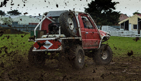 4X4 vehicle spinning up lots of mud 