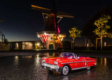 Foxton, Horowhenua, New Zealand, 06.19.2019 Chevrolet Impala model at Foxton Dutch windmill late evening.のeditorial素材
