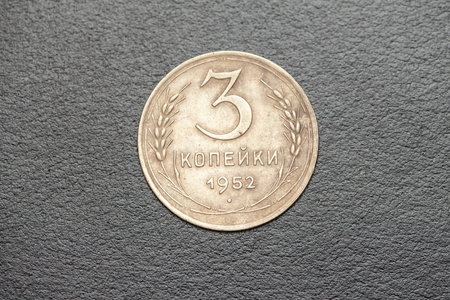 A single coin on black backgroundの写真素材