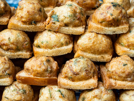 Fried bread with minced pork spread for sale at a local street food market in Bangkok, Thailand.の写真素材