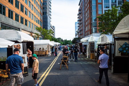 On a refreshing spring day in Reston, Virginia, immerse yourself in the vibrant atmosphere of an art exhibition, bustling with stalls and people.のeditorial素材