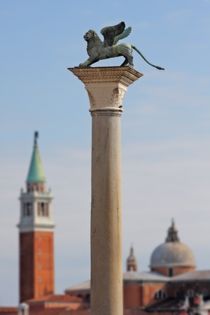 Column with lion-symbol of Venice in front of San Giorgio Maggiore church in Venice, Italy.の写真素材