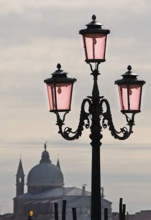 Street lamppost  in front of San Giorgio Maggiore church in Venice, Italy.の写真素材