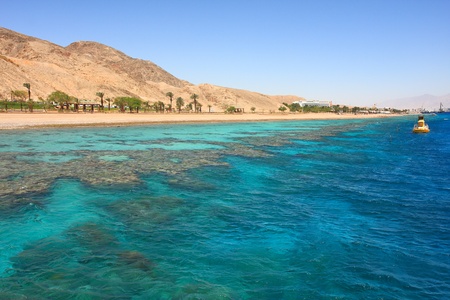 View on red mountains along beautiful shoreline of Red Sea in Eilat, Israel.の写真素材