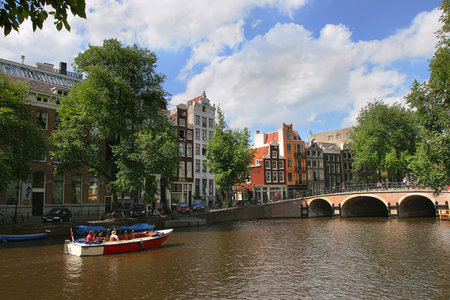 View on Amstel river (city canal) and historic houses in Amsterdam, Netherlands (Holland).のeditorial素材