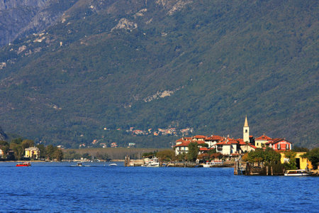 Small village on lake Maggiore among the mountains in northern Italy.のeditorial素材