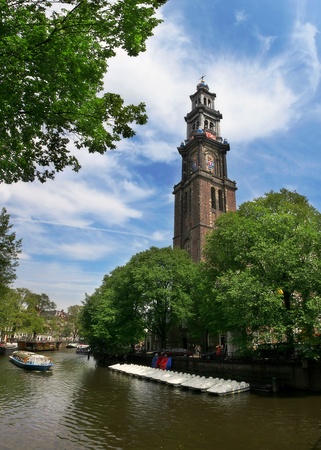 View on Amstel river and Westerkerk church (western church) in Amsterdam, Netherlands.の写真素材
