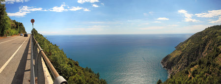 Aerial panoramic view on hill and highway running along Mediterranean Sea in Liguria, Italy.