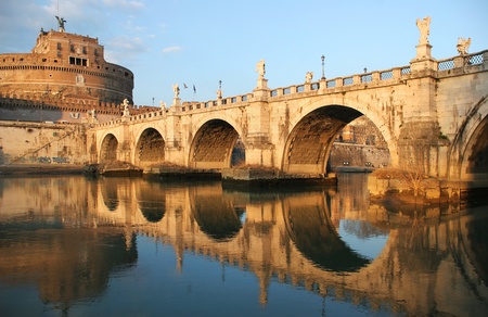 View on famous Saint Angel castle and bridge over the Tiber river in Rome, Italy.の写真素材