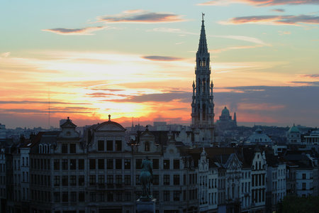 View on historic center of Brussels against beautiful sunset sky at evening.のeditorial素材
