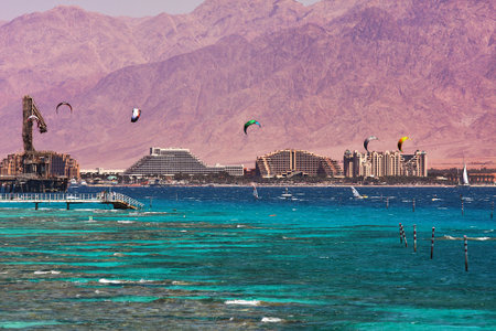 View on coastline with hotels, mountains and bay of Eilat located on Red Sea in Israel.のeditorial素材