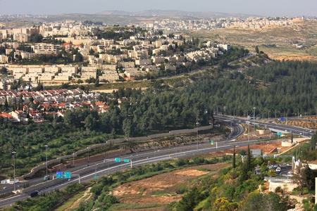 Aerial view on highway among hills and city quarters of Jerusalem, Israel の写真素材