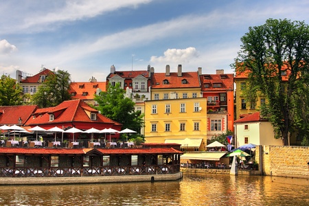 Old colorful houses on Vltava River in historic part of Prague, Czech Republic の写真素材